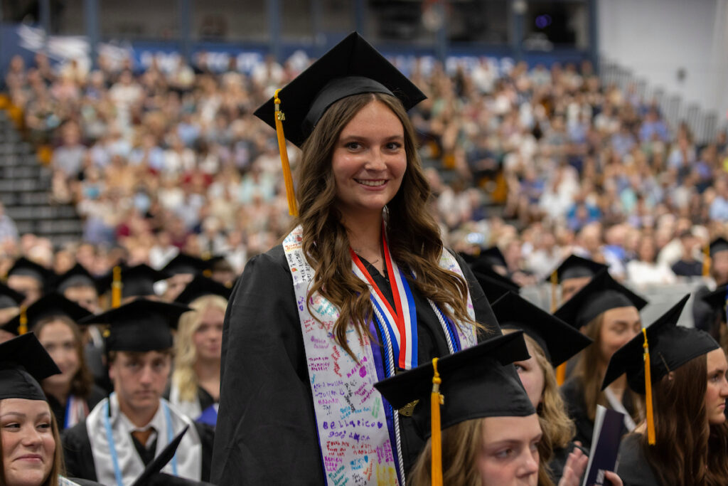 Students receive diplomas and celebrate with friends and family.