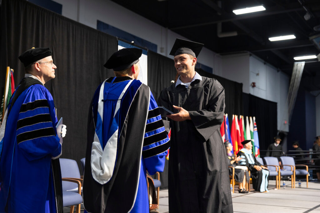 Students receive diplomas and celebrate with friends and family.