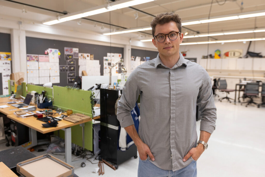 A student works on a 3D model of a capstone project.