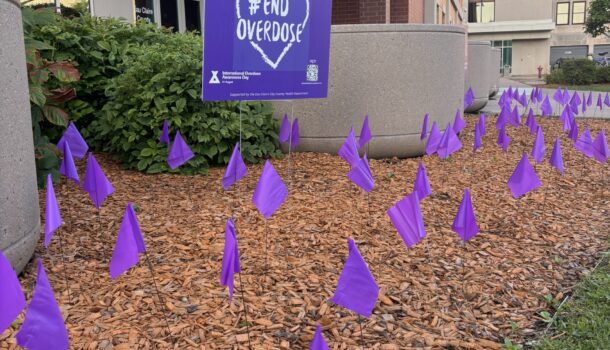Flag display outside Government Center honors lost loved ones on Overdose Awareness Day
